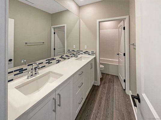 Bathroom, Dual Sink Vanities, Interior, Recessed Lighting, Wood Texture Flooring