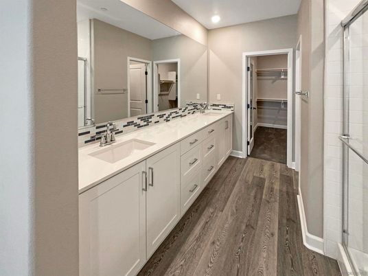 Bathroom, Dual Sink Vanities, Interior, Recessed Lighting, Walk-in Closets, Wood Texture Flooring