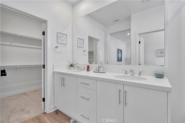 Bathroom, Dual Sink Vanities, Interior, Recessed Lighting, Walk-in Closets, Wood Texture Flooring