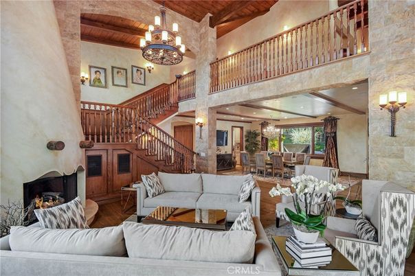Chandelier, Dining room, Fireplace, Interior, Living room, Recessed Lighting, Stone Walls, Wooden Beams, Wooden Ceilings, Wood Texture Flooring