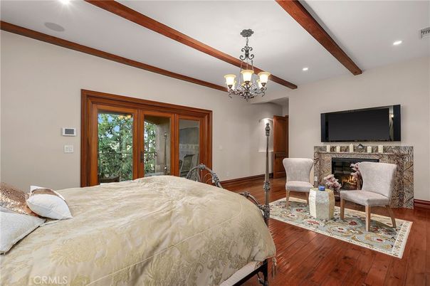 Bedroom, Chandelier, Fireplace, Interior, Recessed Lighting, Wooden Beams, Wood Texture Flooring
