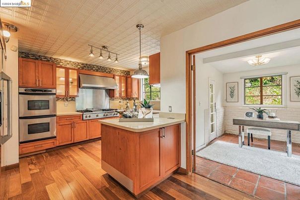 Chandelier, Dining room, Interior, Kitchen, Pendant Lights, Stainless Steel Appliances, Wood Texture Flooring