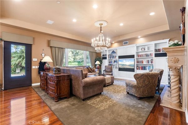 Chandelier, Fireplace, Interior, Living room, Recessed Lighting, Wood Texture Flooring