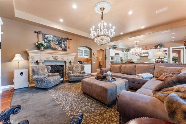 Chandelier, Fireplace, Interior, Living room, Recessed Lighting, Wood Texture Flooring
