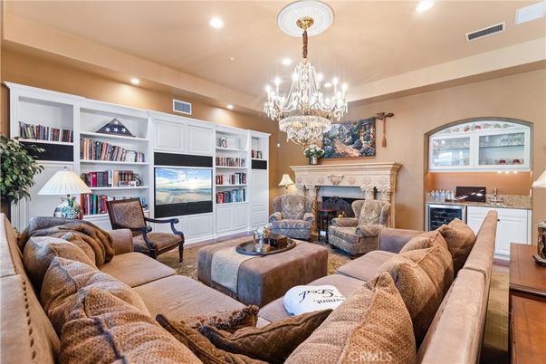 Chandelier, Fireplace, Interior, Living room, Recessed Lighting, Wood Texture Flooring