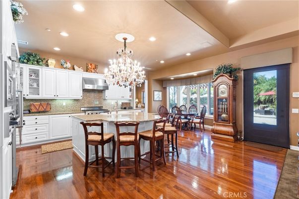 Chandelier, Dining room, Interior, Kitchen, Recessed Lighting, Stainless Steel Appliances, Wood Texture Flooring