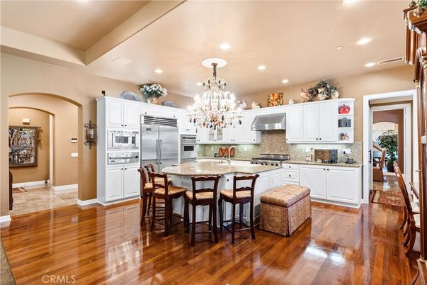 Chandelier, Interior, Kitchen, Recessed Lighting, Stainless Steel Appliances, Wood Texture Flooring
