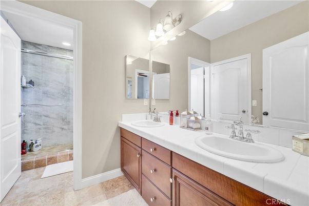 Bathroom, Dual Sink Vanities, Glass Shower, Interior, Recessed Lighting, Tile Countertops