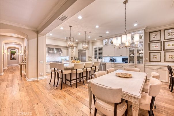 Chandelier, Dining room, Interior, Kitchen, Pendant Lights, Recessed Lighting, Stainless Steel Appliances, Wood Texture Flooring