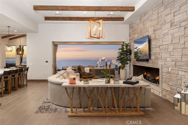 Fireplace, Interior, Living room, Pendant Lights, Recessed Lighting, Stone Walls, Water, Wooden Beams, Wood Texture Flooring