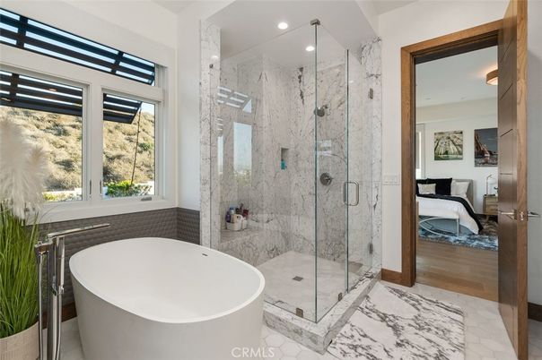 Bathroom, Free Standing Baths, Glass Shower, Interior, Marble, Marble Walls, Recessed Lighting, Wood Texture Flooring