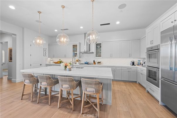 Interior, Kitchen, Marble Walls, Pendant Lights, Recessed Lighting, Stainless Steel Appliances, Wood Texture Flooring