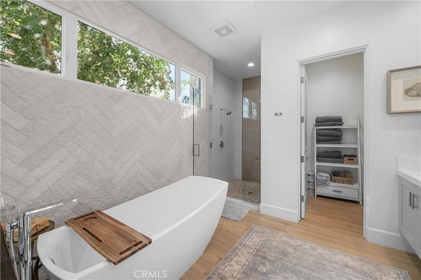 Bathroom, Free Standing Baths, Glass Shower, Interior, Recessed Lighting, Wood Texture Flooring