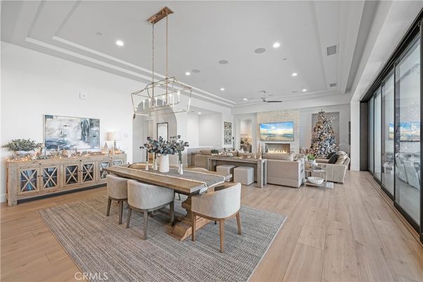 Dining room, Fireplace, Interior, Living room, Pendant Lights, Recessed Lighting, Wood Texture Flooring