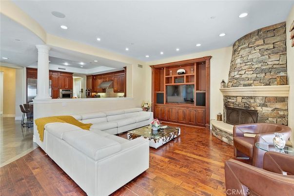 Dining room, Fireplace, Interior, Kitchen, Living room, Recessed Lighting, Stone Walls, Wood Texture Flooring