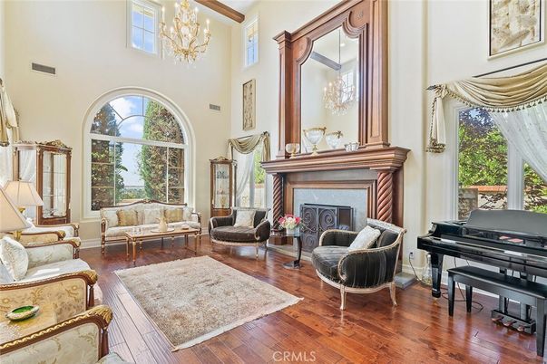 Chandelier, Fireplace, Interior, Living room, Piano, Wood Texture Flooring