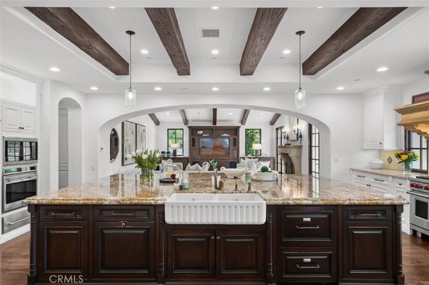Chandelier, Interior, Kitchen, Living room, Pendant Lights, Recessed Lighting, Stainless Steel Appliances, Wooden Beams, Wood Texture Flooring