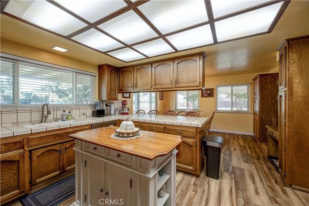 Interior, Kitchen, Recessed Lighting, Tile Countertops, Wood Texture Flooring