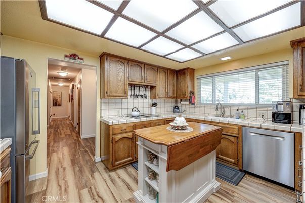 Interior, Kitchen, Recessed Lighting, Tile Countertops, Wood Texture Flooring