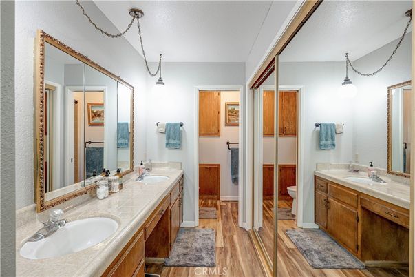 Bathroom, Dual Sink Vanities, Interior, Pendant Lights, Tile Countertops, Wood Texture Flooring