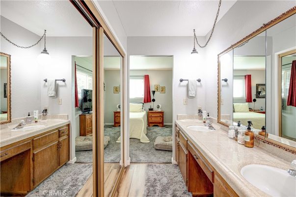 Bathroom, Dual Sink Vanities, Interior, Pendant Lights, Tile Countertops, Wood Texture Flooring