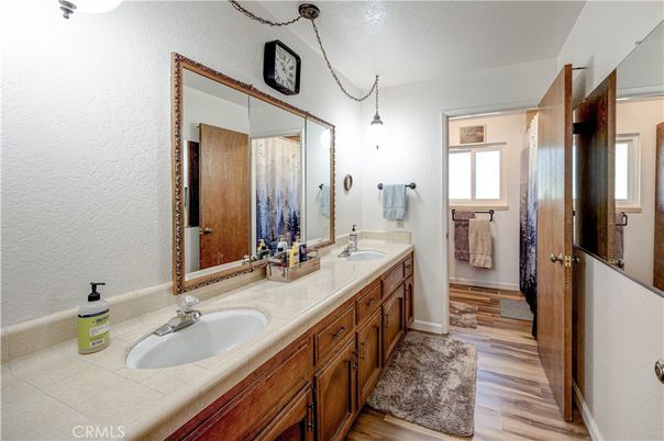 Bathroom, Dual Sink Vanities, Interior, Pendant Lights, Tile Countertops, Wood Texture Flooring