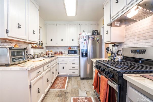 Interior, Kitchen, Stainless Steel Appliances, Tile Countertops, Wood Texture Flooring