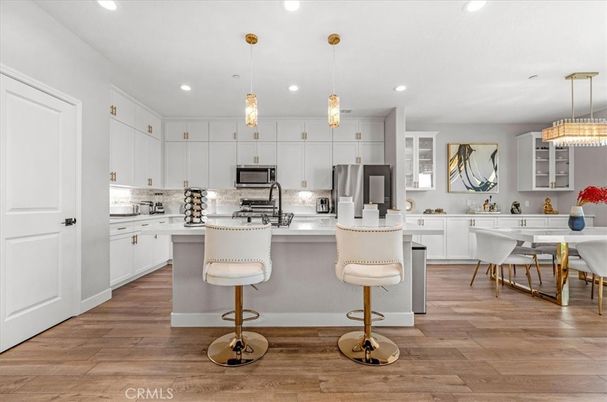 Dining room, Interior, Kitchen, Pendant Lights, Recessed Lighting, Stainless Steel Appliances, Wood Texture Flooring