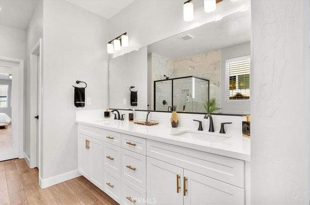 Bathroom, Dual Sink Vanities, Interior, Marble Walls, Wood Texture Flooring