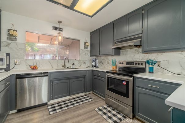 Interior, Kitchen, Marble Walls, Pendant Lights, Stainless Steel Appliances, Wood Texture Flooring