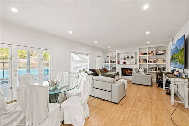 Dining room, Fireplace, Interior, Living room, Recessed Lighting, Wood Texture Flooring