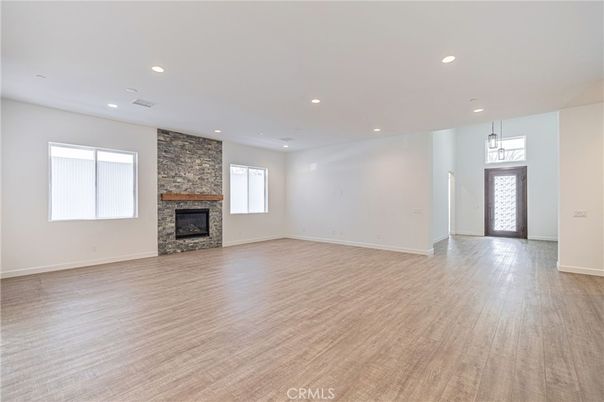 Empty room, Fireplace, Interior, Pendant Lights, Recessed Lighting, Wood Texture Flooring
