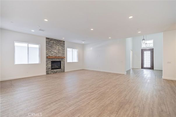 Empty room, Fireplace, Interior, Pendant Lights, Recessed Lighting, Wood Texture Flooring