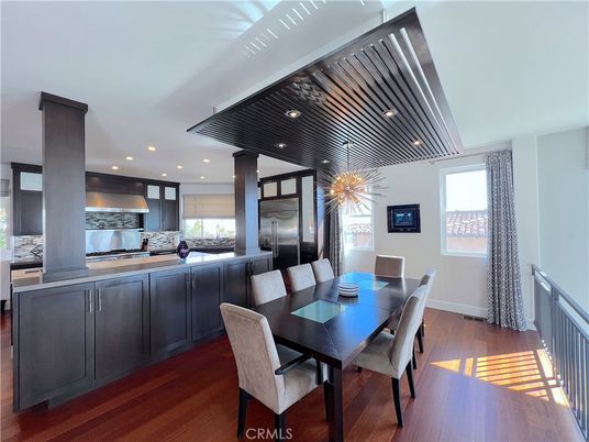 Dining room, Interior, Kitchen, Pendant Lights, Recessed Lighting, Stainless Steel Appliances, Wood Texture Flooring
