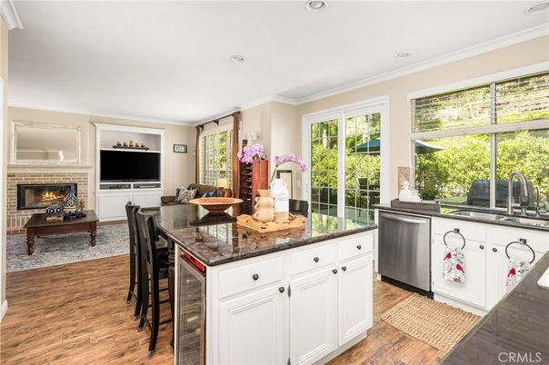 Dining room, Fireplace, Interior, Kitchen, Living room, Recessed Lighting, Wood Texture Flooring
