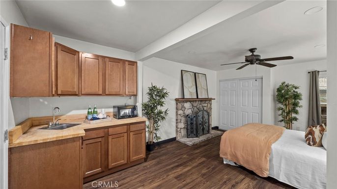 Bedroom, Fireplace, Interior, Recessed Lighting, Wood Texture Flooring