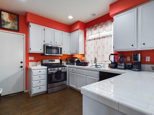 Interior, Kitchen, Recessed Lighting, Tile Countertops, Wood Texture Flooring