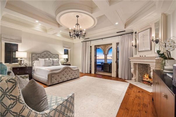 Bedroom, Chandelier, Fireplace, Interior, Recessed Lighting, Wood Texture Flooring