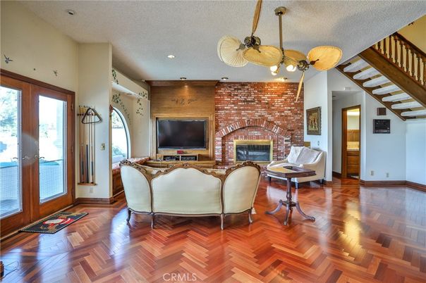 Fireplace, Interior, Living room, Recessed Lighting, Stone Walls, Wood Texture Flooring