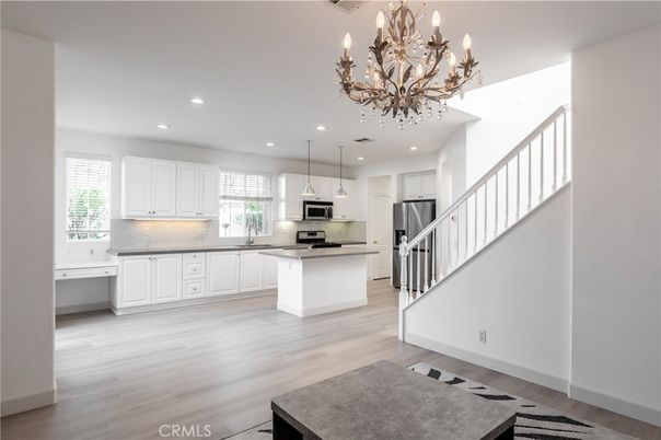 Chandelier, Interior, Kitchen, Pendant Lights, Recessed Lighting, Stainless Steel Appliances, Wood Texture Flooring