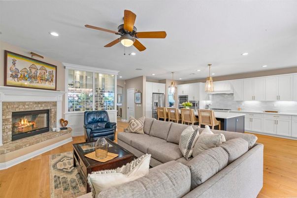 Dining room, Fireplace, Interior, Kitchen, Living room, Pendant Lights, Recessed Lighting, Stainless Steel Appliances, Wood Texture Flooring