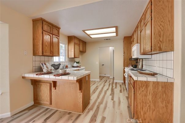 Interior, Kitchen, Tile Countertops, Wood Texture Flooring