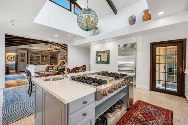 Chandelier, Dining room, Fireplace, Interior, Kitchen, Living room, Pendant Lights, Recessed Lighting, Stainless Steel Appliances, Wooden Beams