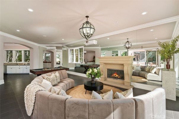 Billiard Table, Fireplace, Game Room, Interior, Living room, Pendant Lights, Recessed Lighting, Wood Texture Flooring