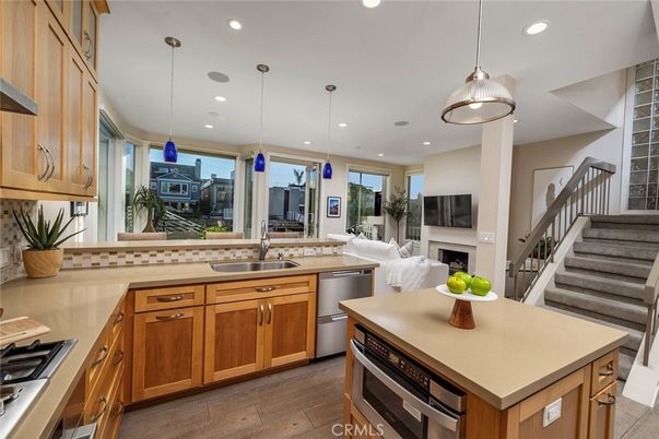 Fireplace, Interior, Kitchen, Pendant Lights, Recessed Lighting, Stainless Steel Appliances, Wood Texture Flooring