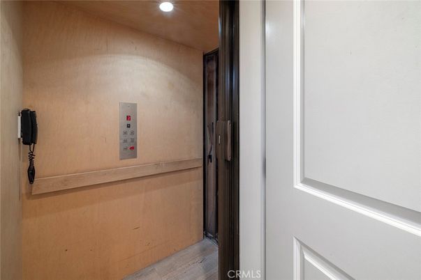 Elevator, Interior, Recessed Lighting, Wood Texture Flooring, Wooden Walls