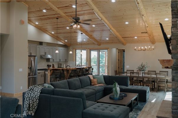 Chandelier, Dining room, Interior, Kitchen, Living room, Pendant Lights, Recessed Lighting, Stainless Steel Appliances, Wooden Beams, Wooden Ceilings, Wood Texture Flooring
