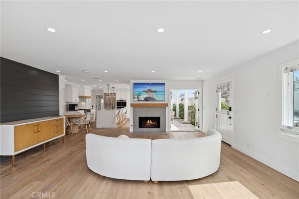 Dining room, Fireplace, Interior, Kitchen, Living room, Pendant Lights, Recessed Lighting, Stainless Steel Appliances, Wood Texture Flooring