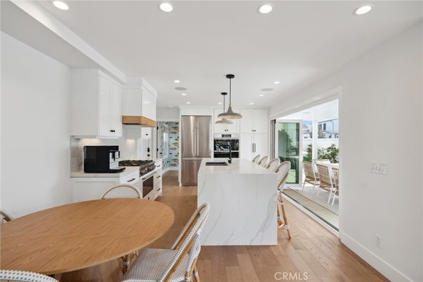 Dining room, Interior, Kitchen, Pendant Lights, Recessed Lighting, Stainless Steel Appliances, Wood Texture Flooring