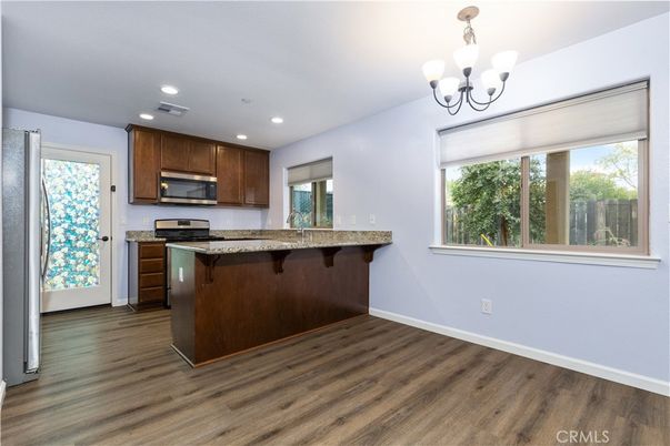 Chandelier, Interior, Kitchen, Recessed Lighting, Stainless Steel Appliances, Wood Texture Flooring